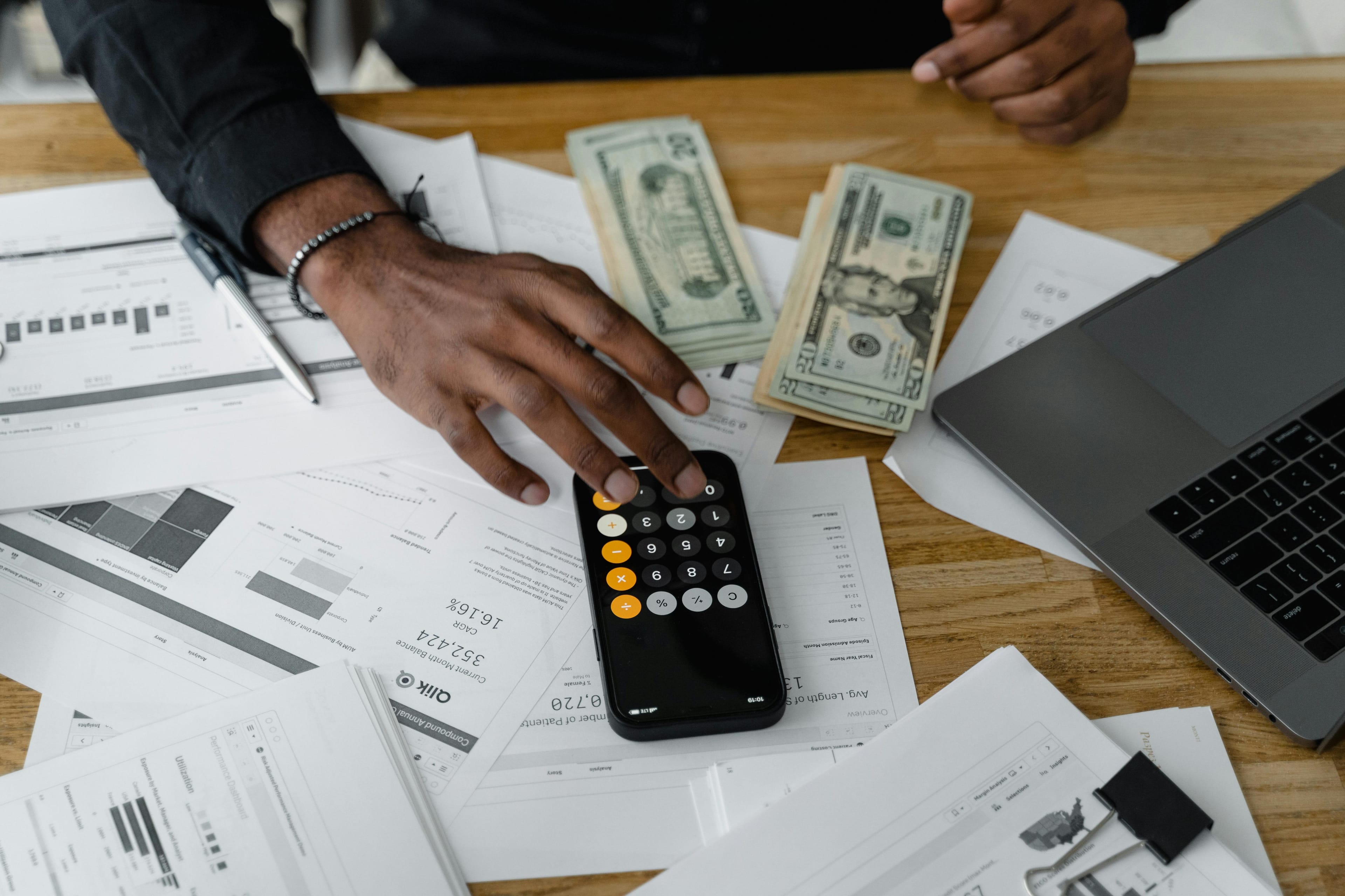 Business finance documents and calculator on a desk